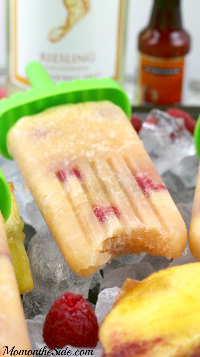 These Peach Raspberry Sangria Popsicles are going to knock your socks off on the way to flavor town. A boozy dessert for adults and super simple to make for those summer parties!