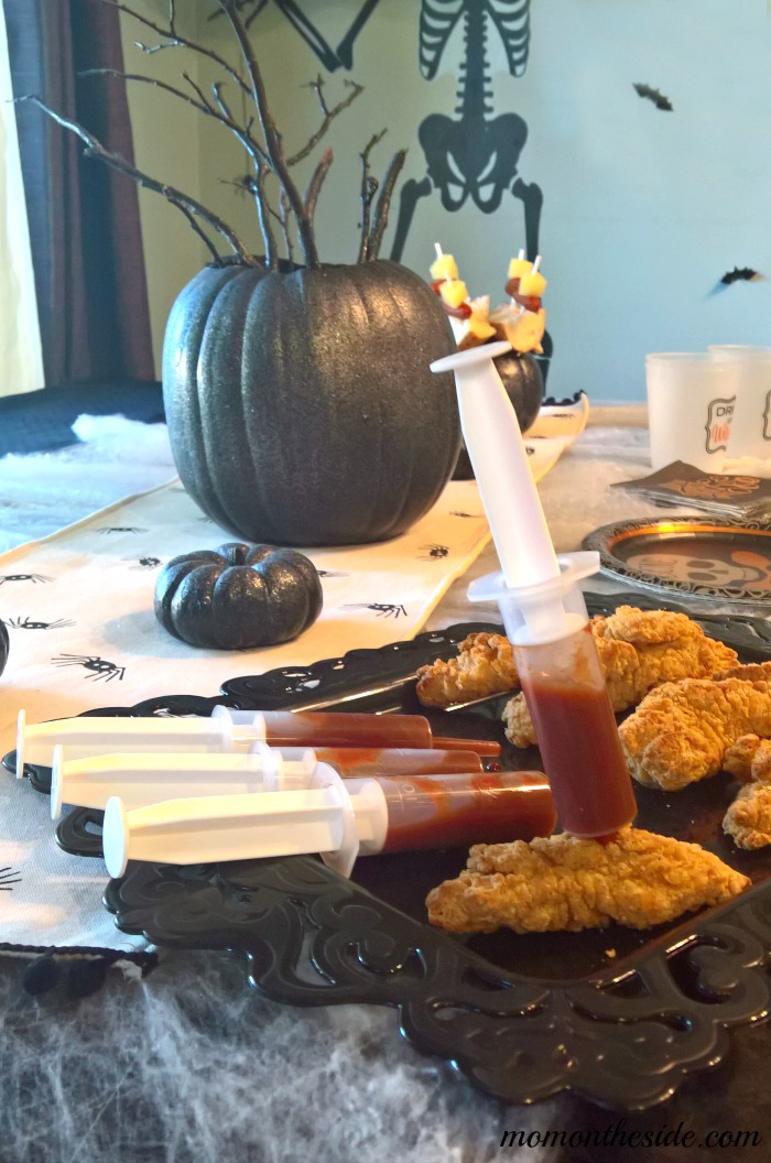 Check out this Adult Halloween Party Tablescape Under $40, with Halloween Party food ideas! See how easy it is to create on Mom on the Side!